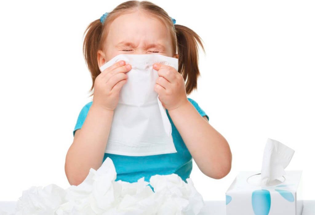 child blowing nose